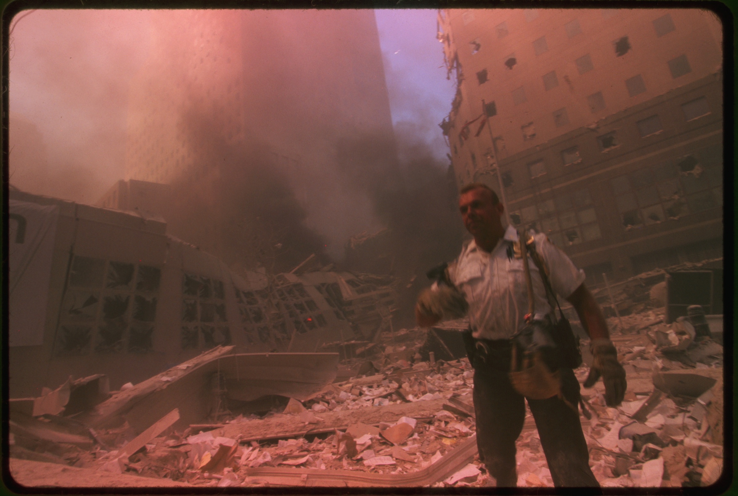 Rescue worker amid ruins following September 11th terrorist attack on World Trade Center, New York City