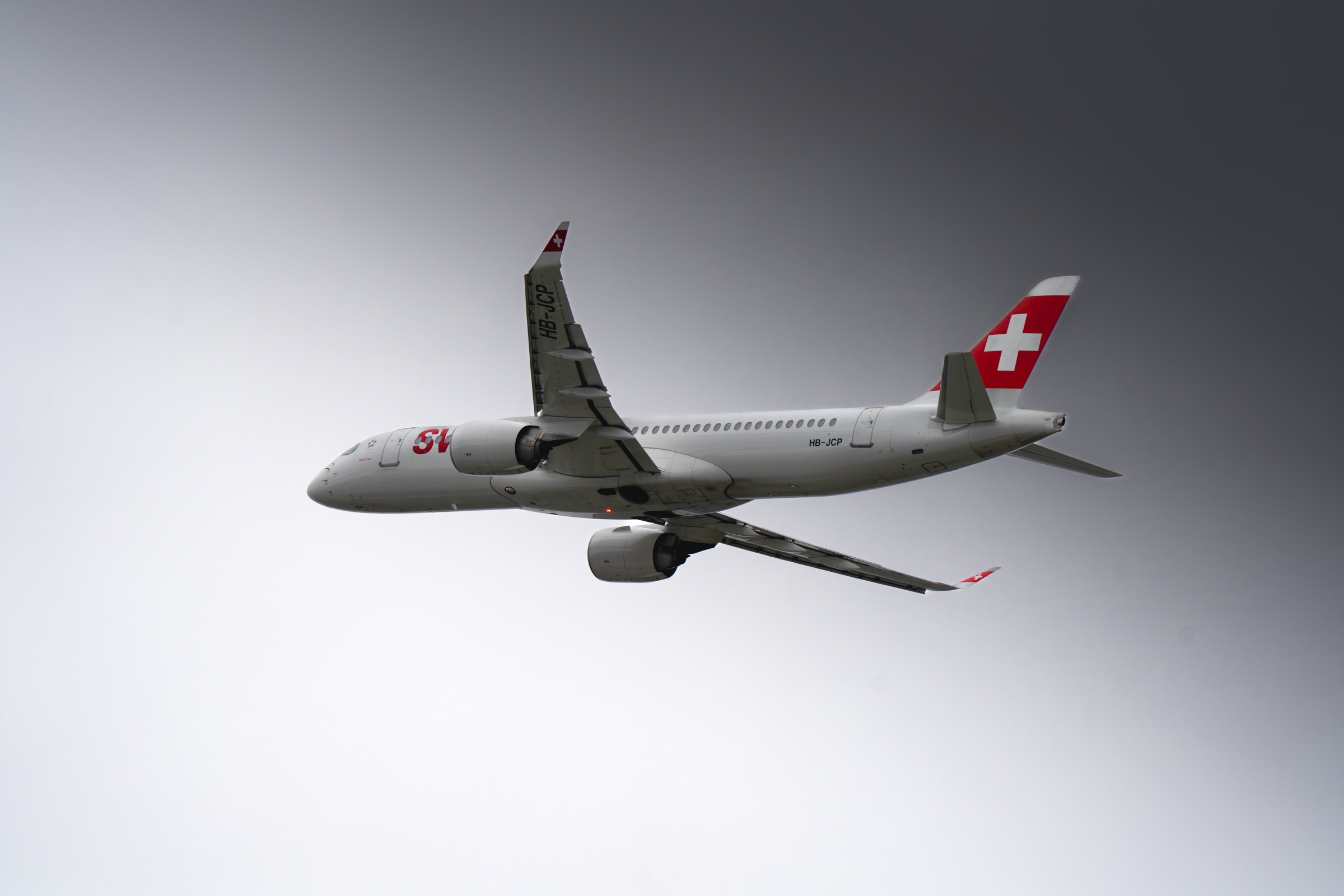 Airplane photographed in the sky over Geneva